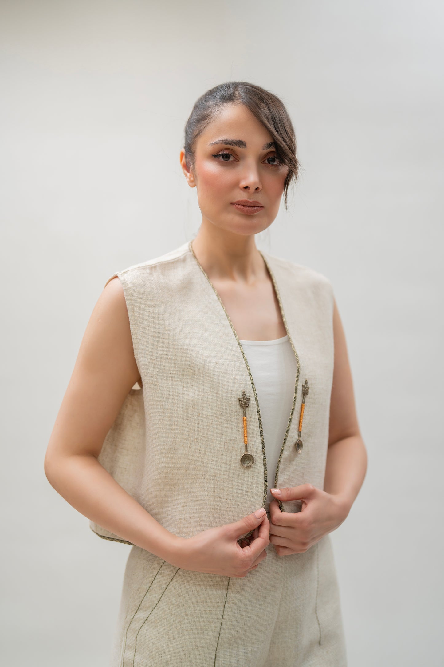 Beige Linen Vest with Antique-Inspired Metal Charms