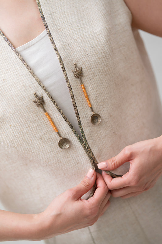 Beige Linen Vest with Antique-Inspired Metal Charms